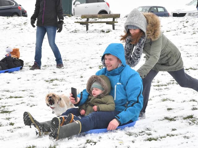 The beast from the East made its presence felt in Portsmouth back in 2018 but that wasn't stopping people from having fun int he snow. 
Pictured: Evelyn Boom pushes Paul and George Higgs on the sled.
Picture: Keith Woodland