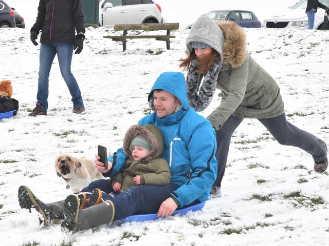 The beast from the East made its presence felt in Portsmouth back in 2018 but that wasn't stopping people from having fun int he snow. Pictured: Evelyn Boom pushes Paul and George Higgs on the sled. Picture: Keith Woodland