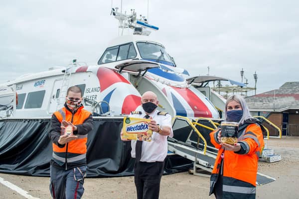 Picture shows (from left to right):  Craig Turner (Team Leader), Paul Grant (pilot) and Samantha Kloppers (crew) all from Hovertravel donating food for the Comfort and Joy campaign