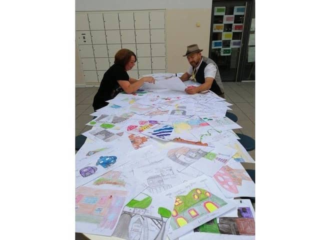 Hard at work, looking through the 150 design suggestions.
