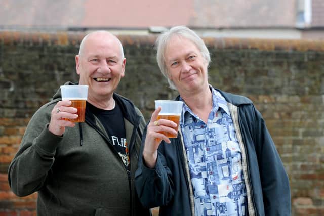 Alex Hood and Jon MacDonald from Portsmouth enjoy a beer at the last Community May Fayre in Fratton in 2019. Picture: Sarah Standing (060519-7147)