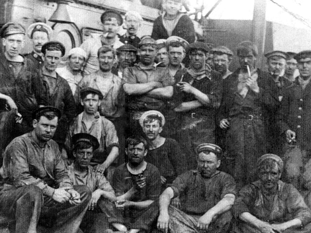 Relaxing after coaling ship.Long before the days of oil and nuclear powered ships, coaling was the order of the day. Picture: Courtesy of George Milliner.