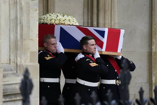 Pallbearers carry the coffin of Major General Matthew Holmes, the former head of the Royal Marines, out of Winchester Cathedral in Hampshire following his funeral service. Maj Gen Holmes commanded 42 Commando Royal Marines from 2006 to 2008 and was appointed as a Companion of the Distinguished Service Order for his leadership on operations in Afghanistan in 2007. Picture date: Wednesday October 13, 2021.