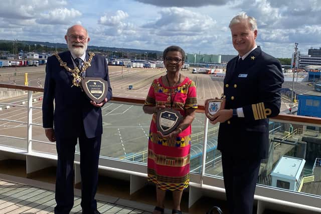 The Lord Mayor, cllr Hugh Mason, and Lady Mayoress Marie Costa receive traditional ships plaques from Captain Sybe de Boer of Seabourn, in return for the city's own ceremonial plaque