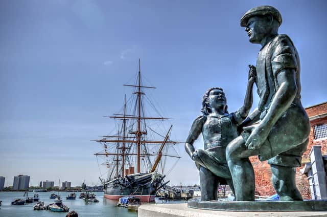 The mudlarks statue can be found as you enter the Historic Dockyard. It's easy to miss this bronze statue which commemorates the generations of Portsea children who enjoyed 'mudlarking' - entertaining travellers by retrieving coins they threw into the mud below the bridge to Portsmouth Harbour Station and Gosport Ferry. Boys and girls would scramble to find money tossed down, sometimes diving into the mud, performing handstands or dipping their heads in it. Many Portsea families lived in poverty, so the small change was welcomed.
The building of the new bus terminal in 1976-77 put an end to all that mucky fun!
In the background the pride of Queen Victoria's navy, HMS Warrior 1860.