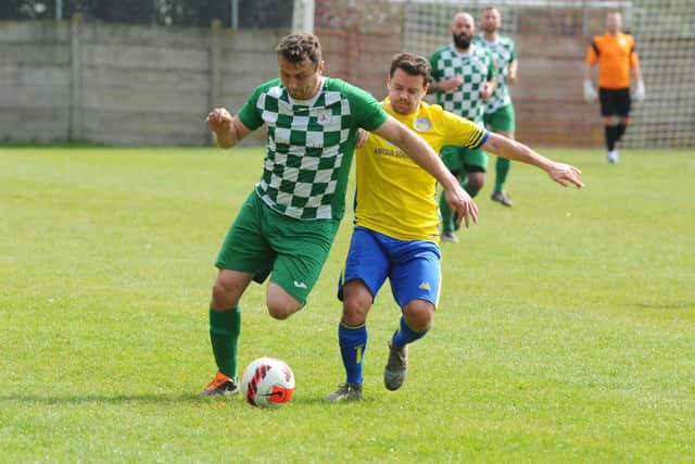 Mob Albion striker Harry Potter, left, with Meon defender Chris Darby.
Picture: Sarah Standing