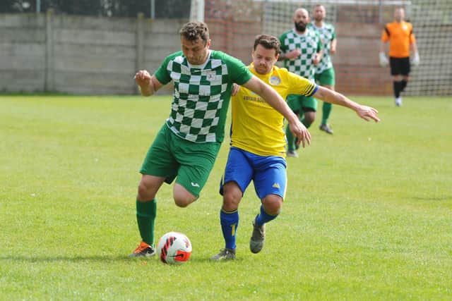 Mob Albion striker Harry Potter, left, with Meon defender Chris Darby.

Picture: Sarah Standing