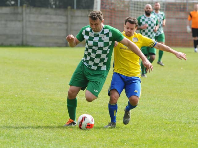 Mob Albion striker Harry Potter, left, with Meon defender Chris Darby.

Picture: Sarah Standing
