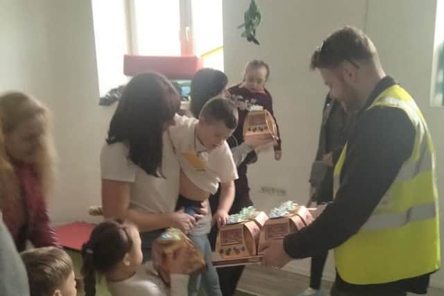 Handing over donations. Picture: Jack Ross
