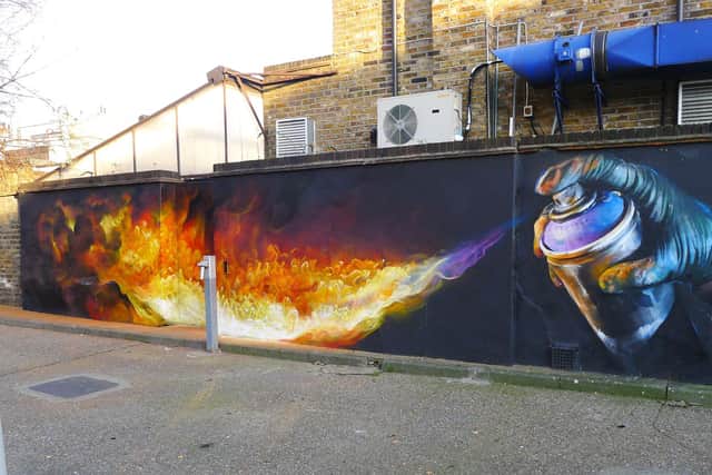 A street mural by Irony, the UK street artist who recently painted the mural in Southsea.