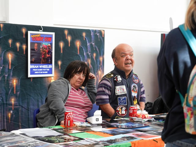 Brian Wheeler from Harry Potter and Star Wars at Comic Con, writing signatures in Gosport. Pictured is: Brian Wheeler Picture: Alec Chapman