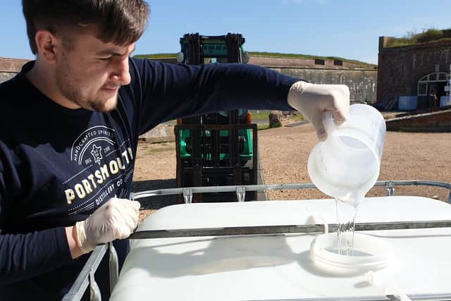 Joshua Collighan making hand sanitiser at the Portsmouth Distillery