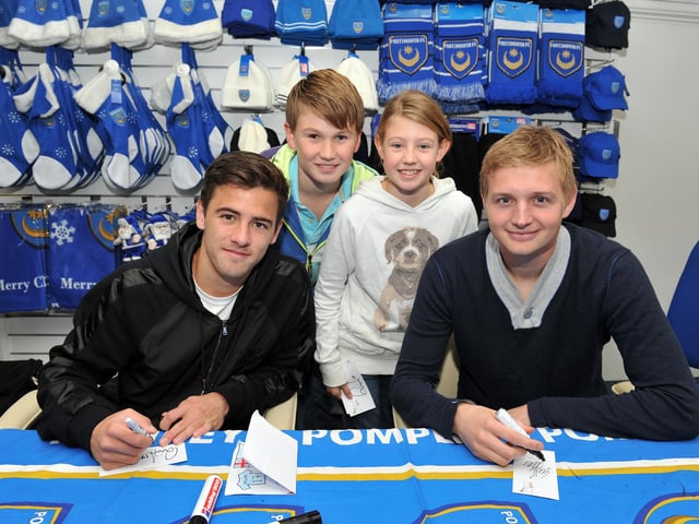 Pompey stars Ryan Williams (left) and Erik Huseklepp (right) meet Ali McGrath (12) and his sister Shona McGrath from Warsash at the Pompey Megastore in 2012