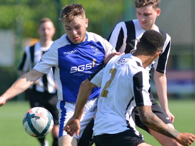 Denmead (blue) v Hayling. Picture by Martyn White