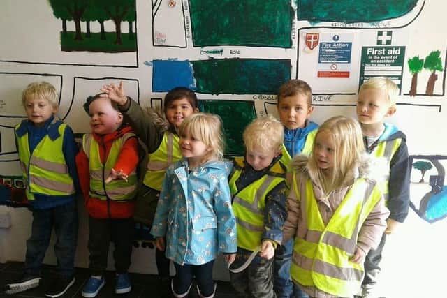 Tops Day Nurseries Havant add their logo to the community wall.