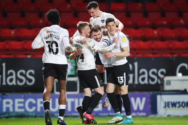 Pompey's players celebrate Michael Jacobs' first-half opener against Charlton. Picture: Joe Pepler