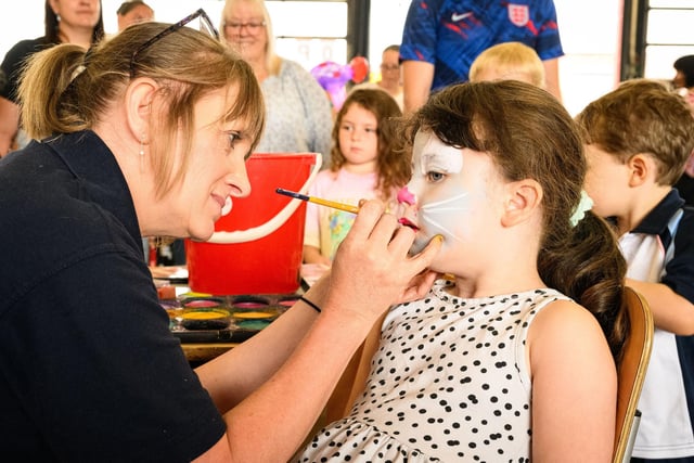 Pictured is: Casey Bayes gets he face painted

Picture: Keith Woodland (100921-59)