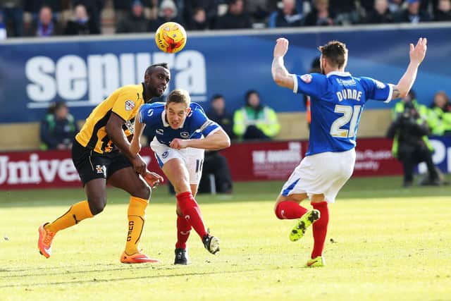 Paul Robinson heads clear against Cambridge United in February 2015. Picture: Joe Pepler