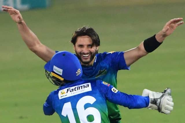 Multan Sultans' Shahid Afridi celebrates after taking a wicket during the Pakistan Super League loss to Islamabad United. Photo by ASIF HASSAN/AFP via Getty Images.