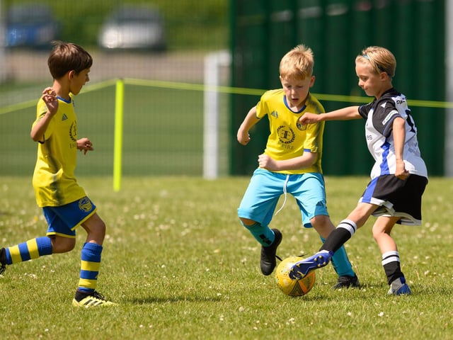 Action from the Clanfield youth football tournament at Horndean Technology College. Picture: Keith Woodland (270521-620)