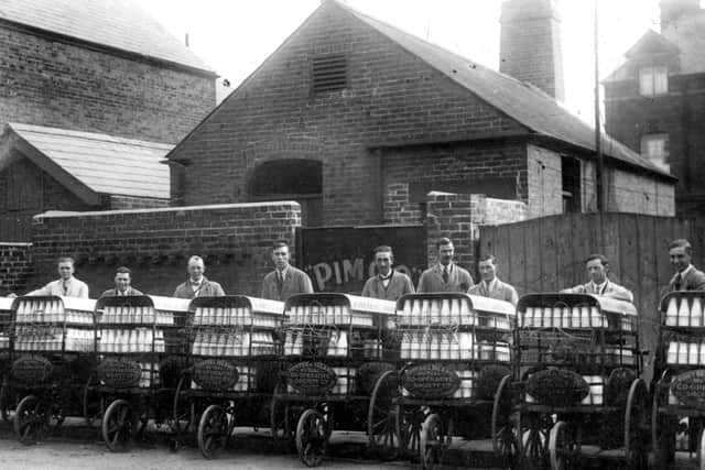 A collection of PIMCO milkmen waiting to set off on their morning rounds in Portsmouth.  All have collars and ties and some bow ties. Picture: costen.co.uk