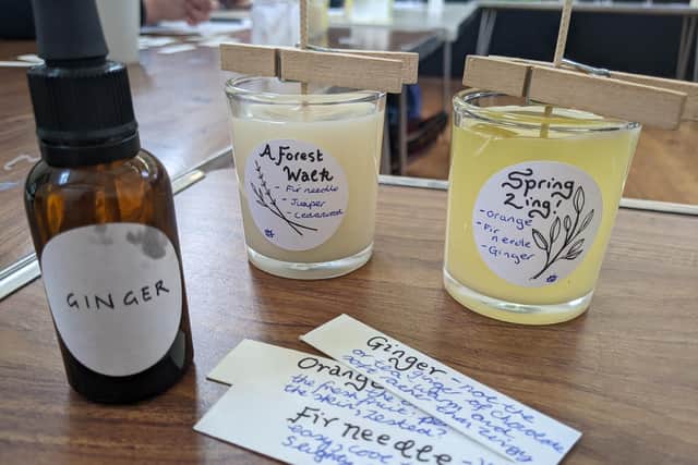 Creating candles by blending essential oils and pouring soy wax. Picture: Emily Turner