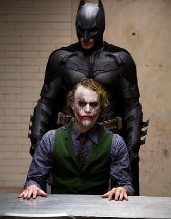 Christian Bale at the Batman and the late Heath Ledger as the Joker