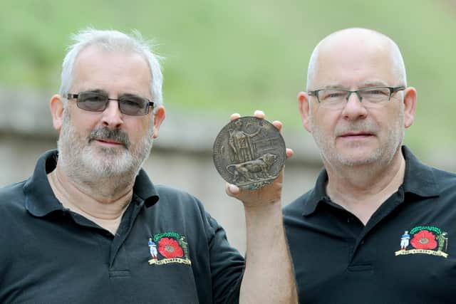 Chris Pennycook, left, who was sent the death penny by Gloucestershire resident, Dot Oakes, after she found it under the floorboards of her house, pictured with Gareth Lewis
Picture: Sarah Standing