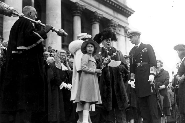 The Queen as an 11-year-old with her father King George VI in Guildhall Square during a visit to Portsmouth in June 1937.
