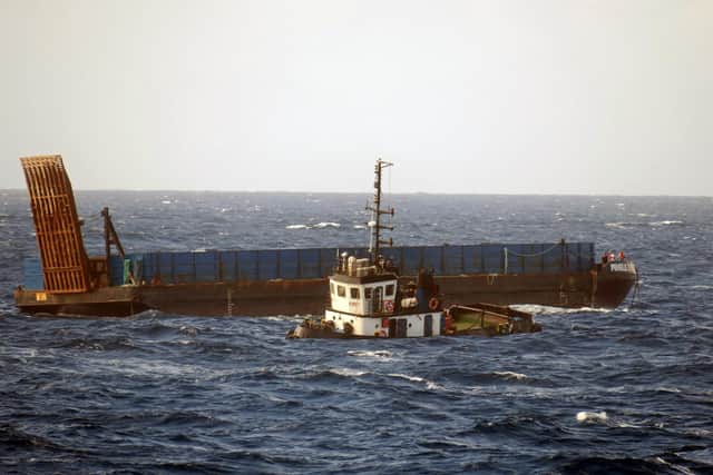 HMS Medway rescuing the crew of an ocean-going tug which started sinking off Anguilla in the Caribbean Picture: Able Seaman Mitchell 'Jack' Macguire/Royal Navy/PA Wire