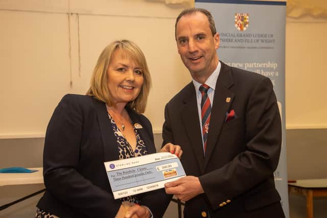 The Rainbow Centre's Yvonne Campbell presented with a cheque. Photos by Alex Shute