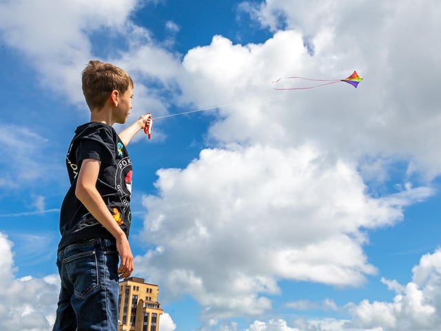 Owen Martin (11) making the most of the brisk seafront breeze at the Southsea Kite Festival. Picture: Mike Cooter (070821)