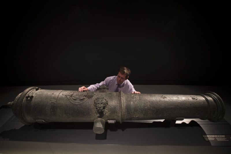 Maintenance Coordinator Brian Robinson poses next to a canon recovered from the wreck of the Mary Rose in the new Mary Rose Museum at Portsmouth's Historic Dockyard on May 16, 2013. Picture: Dan Kitwood/Getty Images