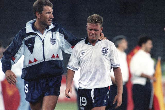 A generation mentally scarred by losing to Germany on penalties - Paul Gascoigne is consoled by Terry Butcher after England's semi-final loss at Italia 90. Picture: Roberto Pfeil, AP