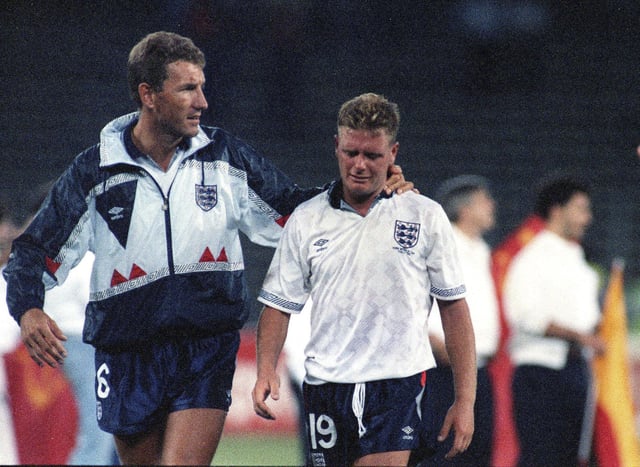 A generation mentally scarred by losing to Germany on penalties - Paul Gascoigne is consoled by Terry Butcher after England's semi-final loss at Italia 90. Picture: Roberto Pfeil, AP