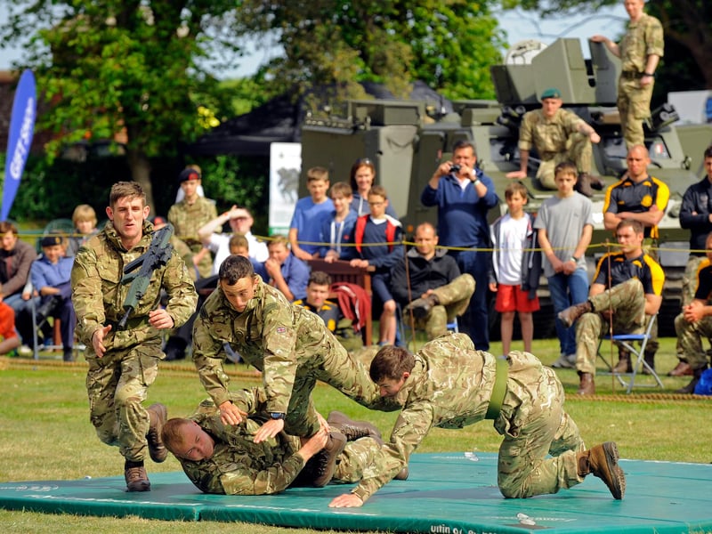 Commandos show how to surprise a 'man on guard duty' and to disarm him. 2015. Picture: Malcolm Wells (150528-8466)