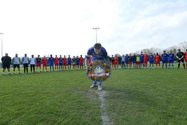 Baffins skipper Morgan Moret lays the wreath in memory of his friend Mason Peddle. Picture: Chris Moorhouse