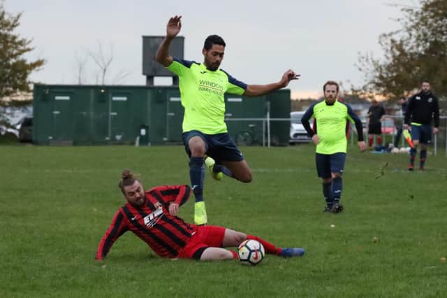 Aiming to return to the city - Harvest Home (lime green) pictured during a home game at the Langstone Harbour ground on the Eastern Road in the 2019/20 season. Picture: Kevin Shipp.
