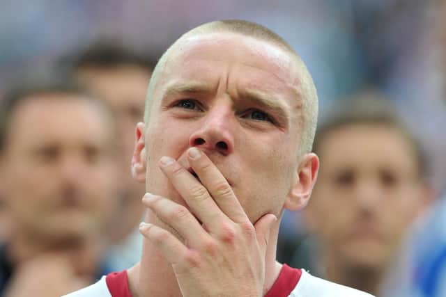 The pain is etched on the face of Pompey's Jamie O'Hara as he watches Chelsea collect the FA Cup in 2010. Picture: Steve Reid