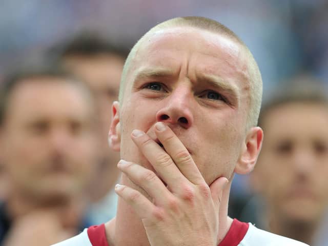 The pain is etched on the face of Pompey's Jamie O'Hara as he watches Chelsea collect the FA Cup in 2010. Picture: Steve Reid