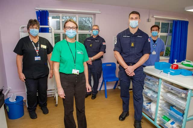 Bank nurse Jane Cameron, vaccination volunteer Elizabeth Maclellan, with Royal Navy team, Rod Morton and Tom Monday and senior clinical quality officer Simon Freathy at St James' Hospital 
Picture: Habibur Rahman