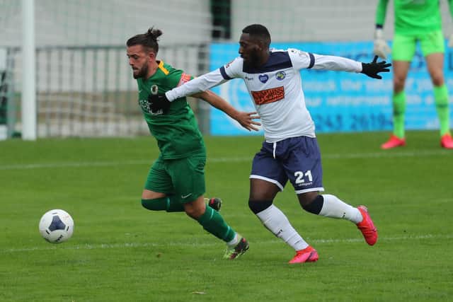 Roarie Deacon battles with Horsham's Jerry O'Sullivan during Hawks' FA Cup win at Bognor Regis. Picture: Dave Haines.