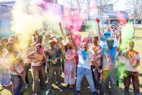 Students and staff celebrating worldwide culture with vibrant puffs of colour