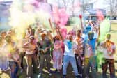 Students and staff celebrating worldwide culture with vibrant puffs of colour
