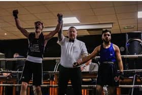 Warrior's Gym ABC's Mason MacGil left, is elated after having his arm raised Picture: Ben Stratford