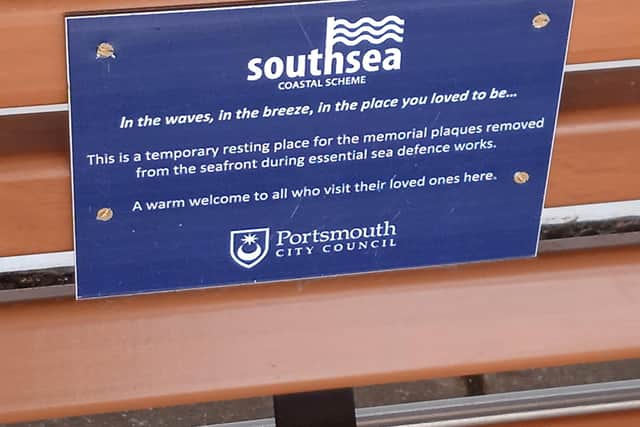 Memorial plaque on temporary benches.