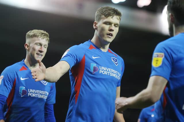 Sean Raggett celebrates, with Ross McCrorie behind him. Picture: Joe Pepler
