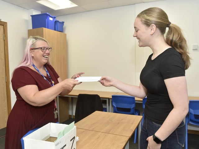 Pupils from King's Academy Brune Park in Gosport, picked up their GCSE results on Thursday, August 22, 2024. Pictured is: Edith Mavin (16) collects her GCSE results from exams officer Lynda Lister.Picture: Sarah Standing (220824-2931)