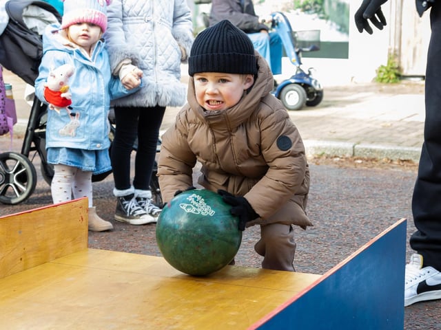 Locals braved the cold to celebrate the start of the Christmas festivites with a street party on Hayling Island on Saturday afternoon.

Pictured - Acer Lawrence, 3 practicing his bowling skills.

Photos by Alex Shute