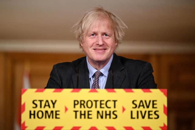 Britain's Prime Minister Boris Johnson attends a virtual press conference inside 10 Downing Street in central London on February 22, 2021, after he earlier set out the Government's roadmap out of the third Covid-19 lockdown. - British Prime Minister Boris Johnson on Monday set out a four-step plan to ease coronavirus restrictions, expressing hope that life could get back to normal by the end of June. In a statement to parliament, he outlined a "gradual and cautious" approach to lifting curbs in England, starting with the reopening of schools from March 8 and non-essential retail from April 12. (Photo by Leon Neal / POOL / AFP) (Photo by LEON NEAL/POOL/AFP via Getty Images)